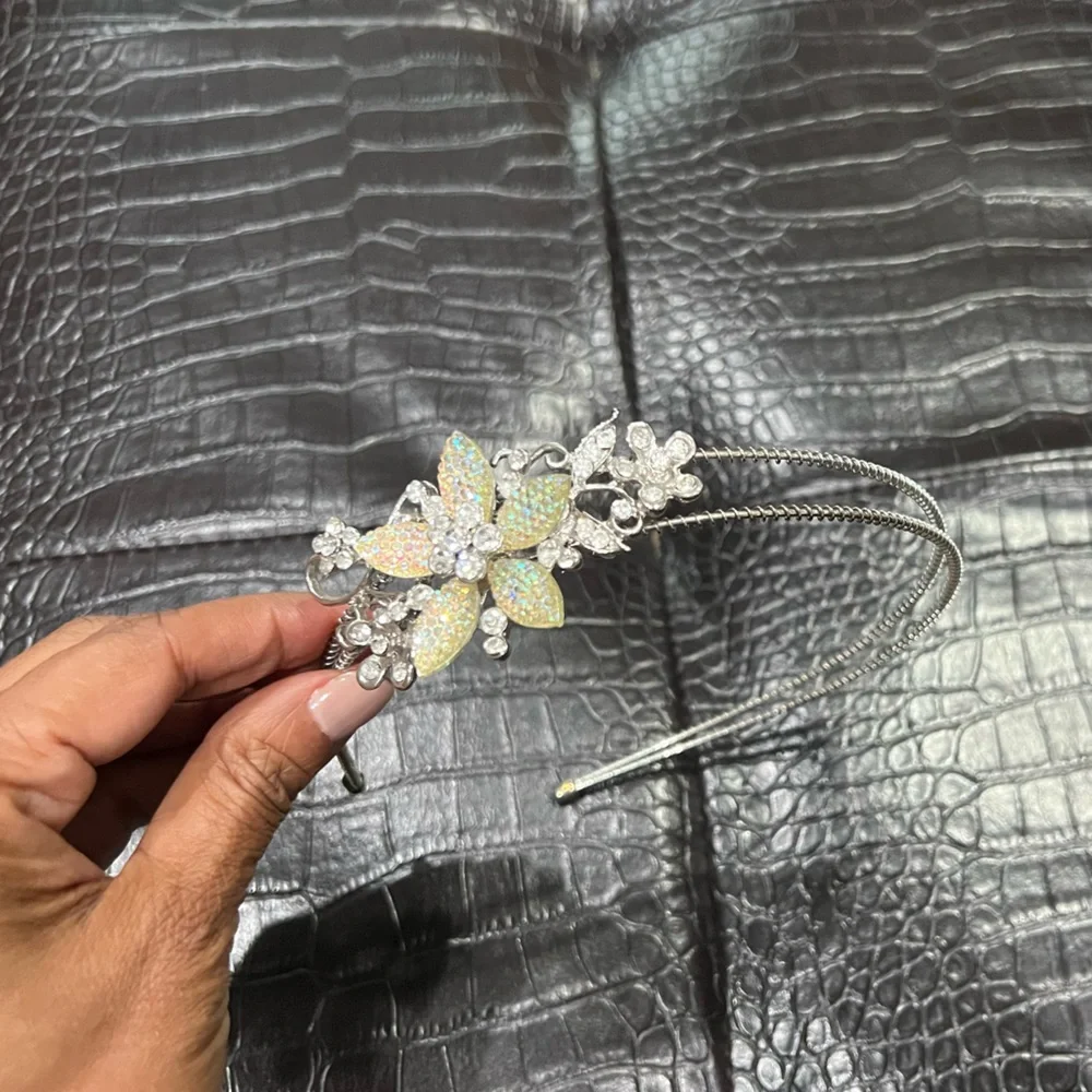 Fancy Flower Head Band in silver and rhinestones.